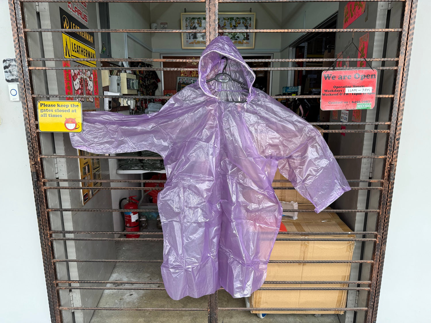 DISPOSABLE PONCHO WITH SLEEVES & DRAWSTRING HOOD