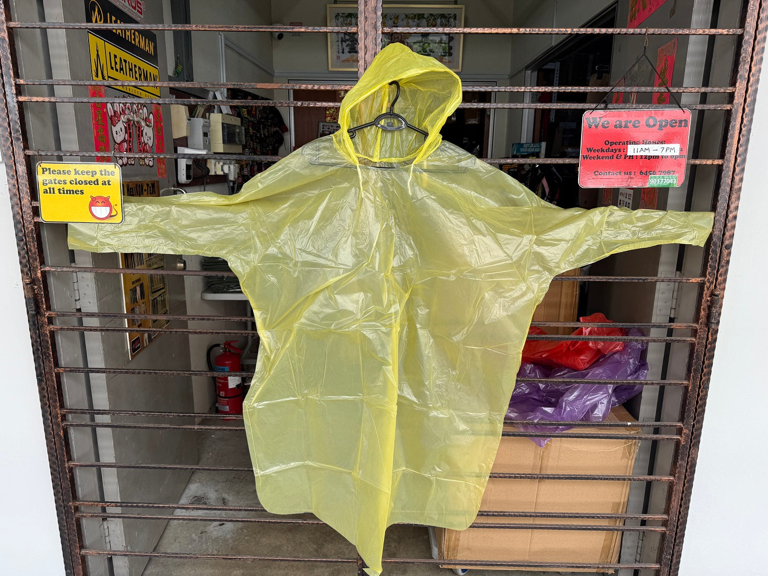 DISPOSABLE PONCHO WITH SLEEVES & DRAWSTRING HOOD